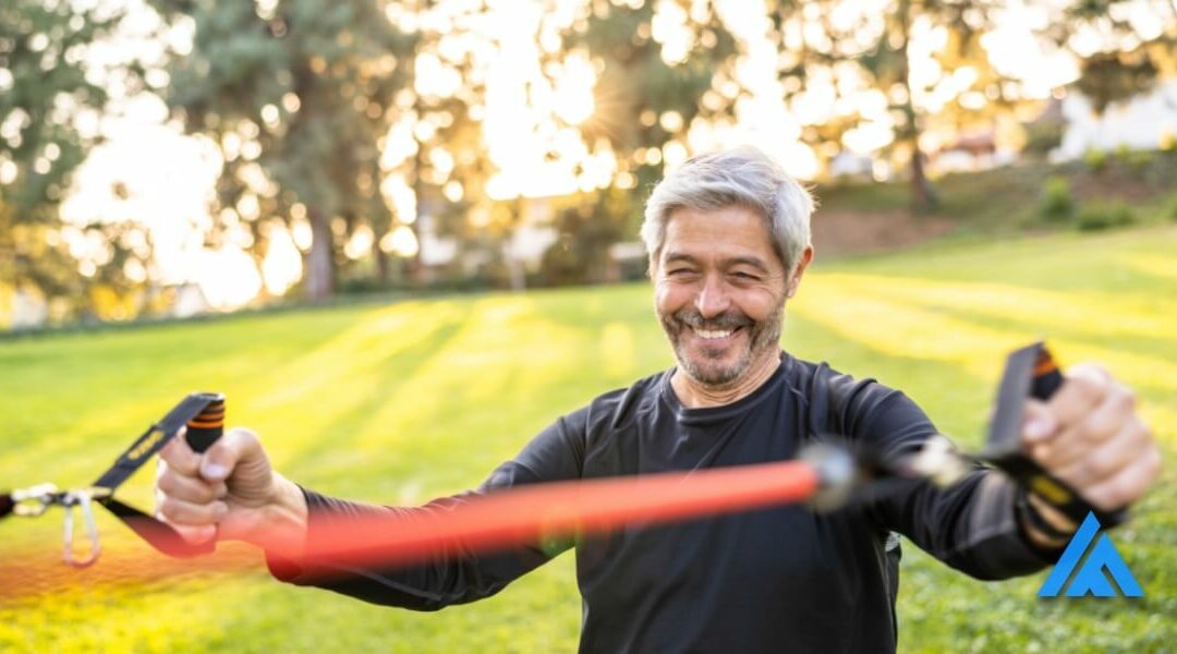 older adult smiling while enjoying the benefits of strength training